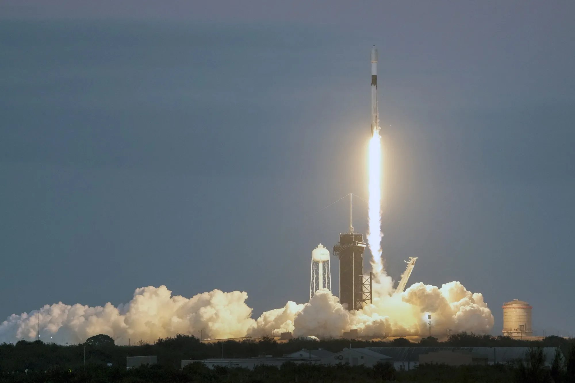 A SpaceX Falcon 9 rocket, with a payload of 40 satellites lifts off from pad 39A at the Kennedy Space Center on Dec. 8.
