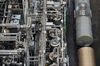 Freight railway containers stand beside pipework at the Evonik Industries AG facilities in Marl Chemical Park in Marl, Germany.