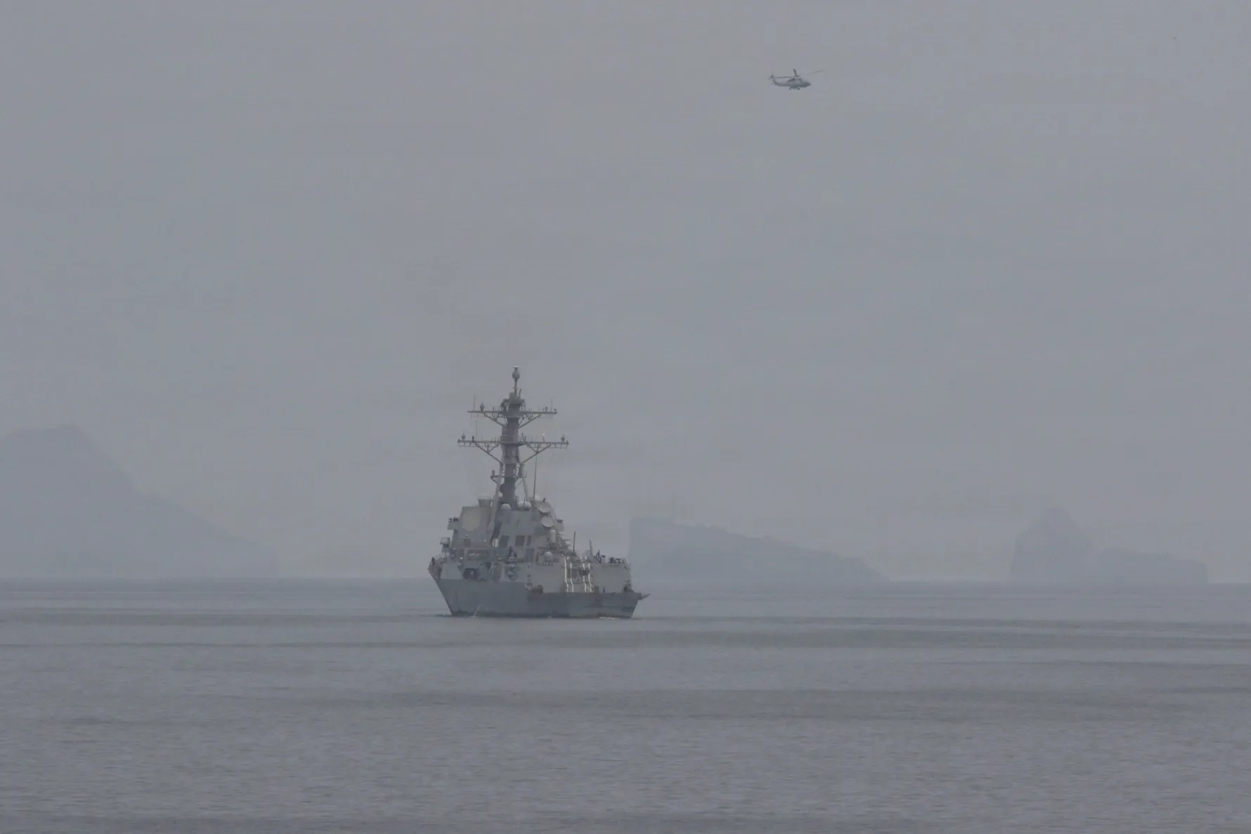 Two US Navy-guided missile destroyers conduct operations in an undisclosed location on April 11, in an image released by the US Central Command.