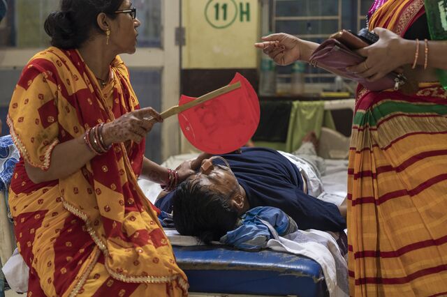 A family member fans a patient at ANMMCH