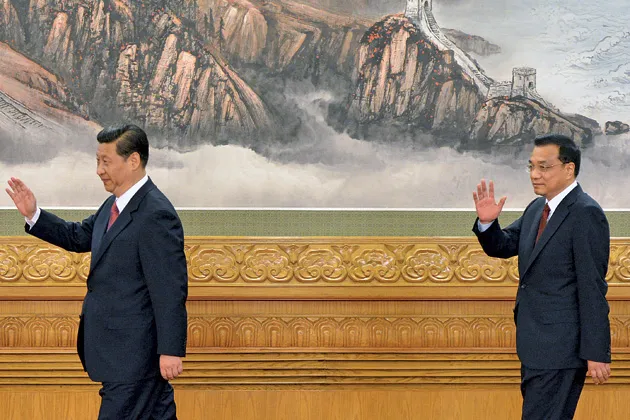 Xi Jinping (left) takes control with growth at its lowest rate in 23 years. Li Keqiang (right), an economist, will try to boost migration into China’s cities