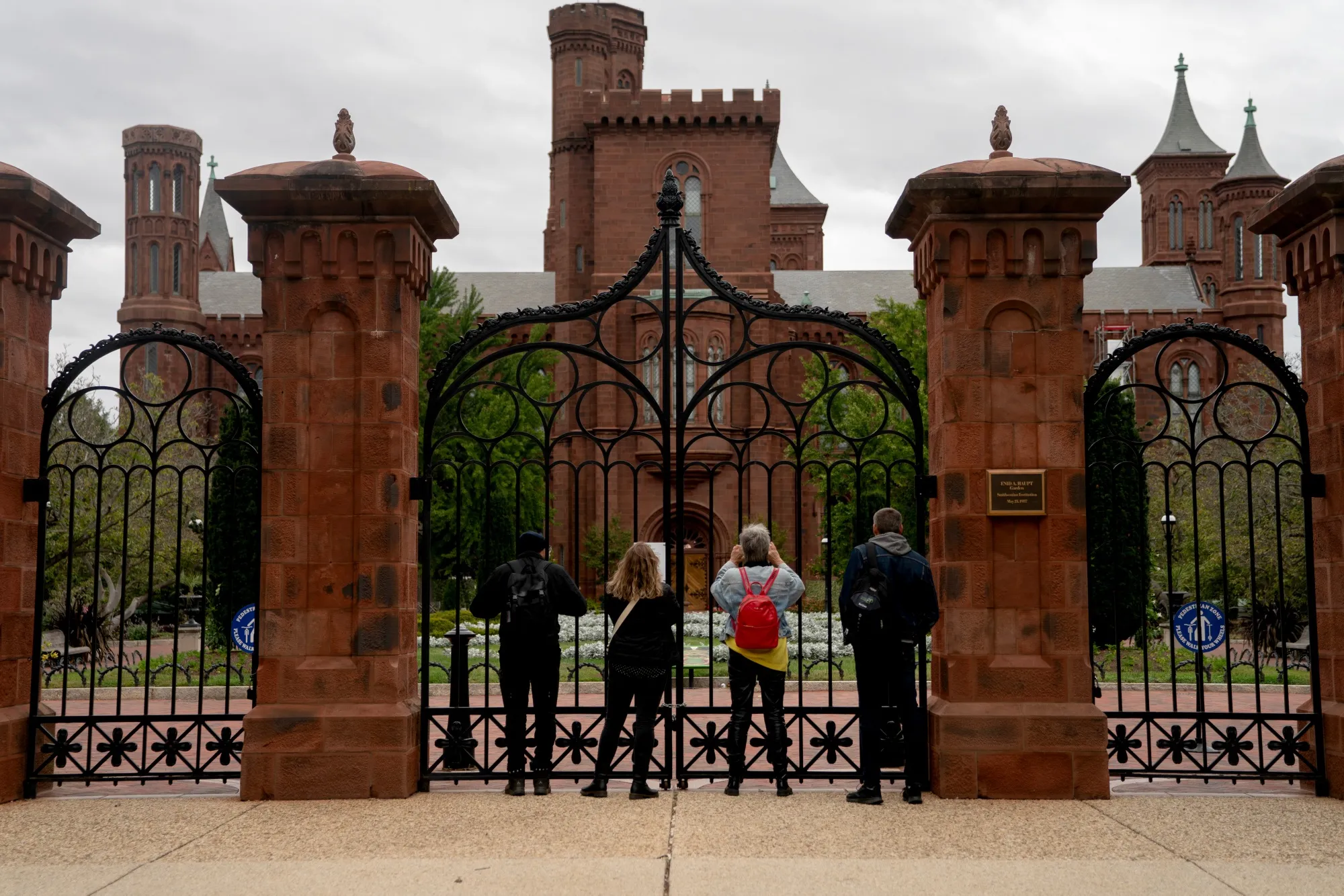 Visitors at a closed gate outside the closed Smithsonian National Museum of African Art in Washington on Oct. 12.