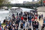 People walk on the right bank of the river Seine, officially prohibited to cars since October 21, 2016.