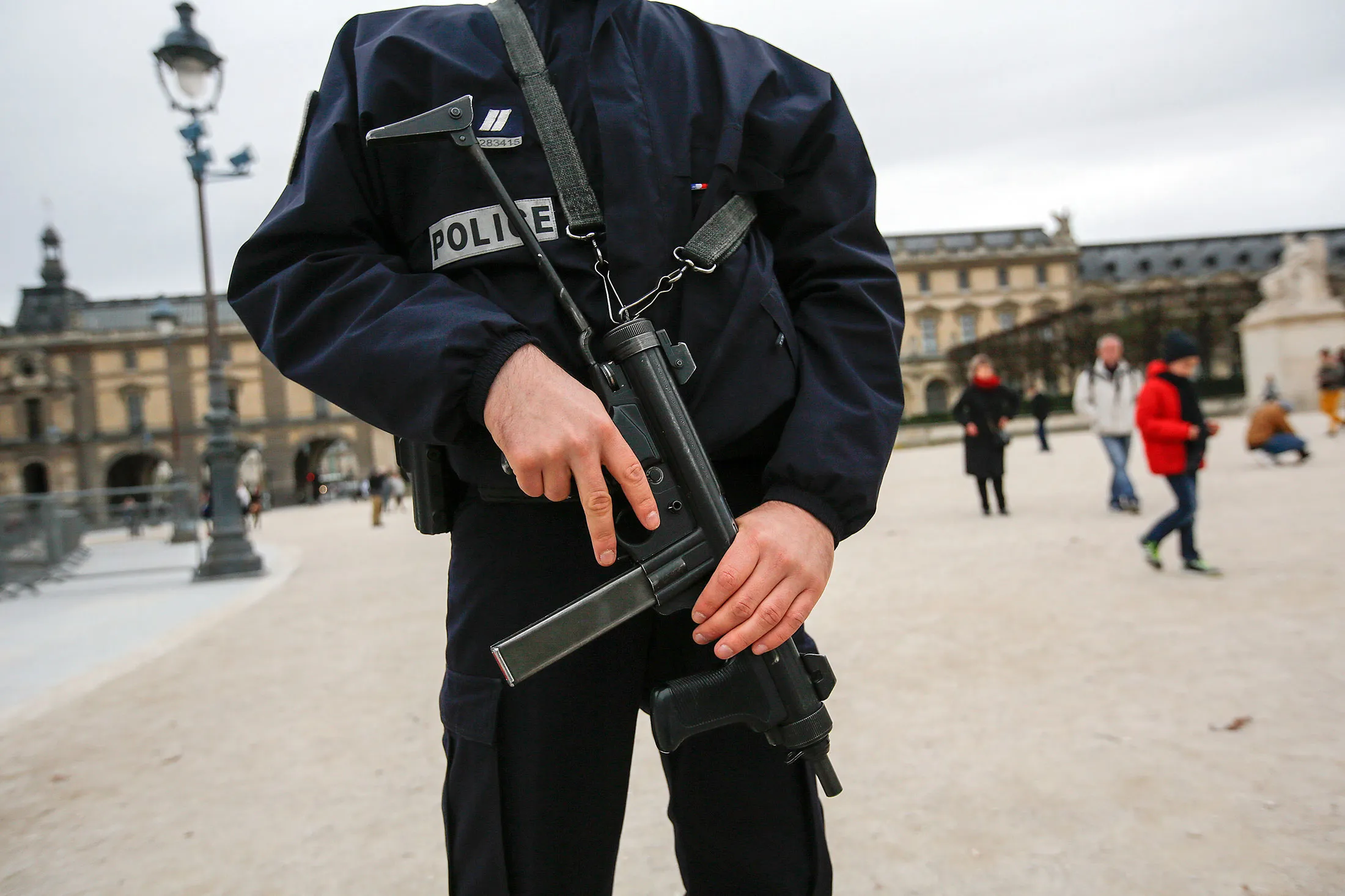 A police officer stands guard at the Louvre museum in Paris, on Nov. 14, 2015.
