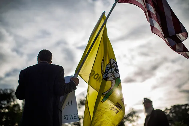 Tea Party member Ron Kirby stands in support of “defunding of Obamacare” outside the U.S. Capitol on Sept. 25