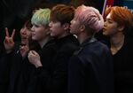 Members of one of South Korea's most beloved K-pop groups, BTS (also known as the Bangtan Boys), pose on a red carpet in Hong Kong. 