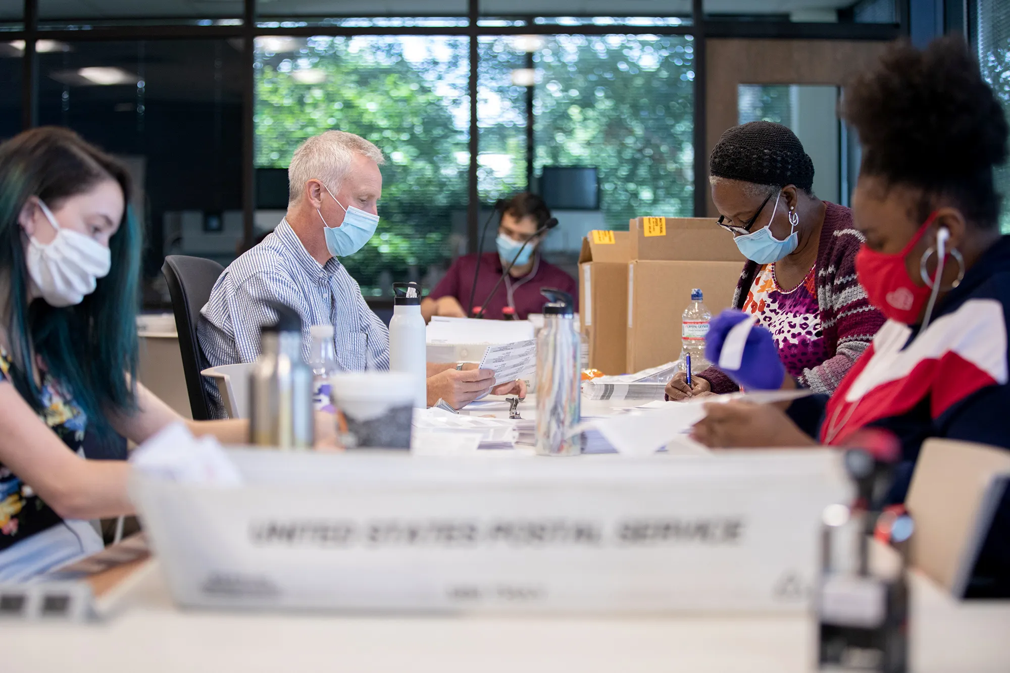 Absentee ballot election workers stuff ballot applications at the Mecklenburg County Board of Elections office in Charlotte, North Carolina on Sept.&nbsp;4.&nbsp;