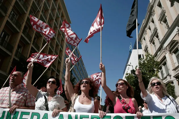 High school teachers shout slogans during an anti-government rally in Athens on Sept. 25, the second day of a 48-hour strike by public-sector workers