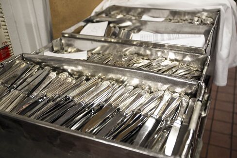 Trays of polished utensils in the silver room.