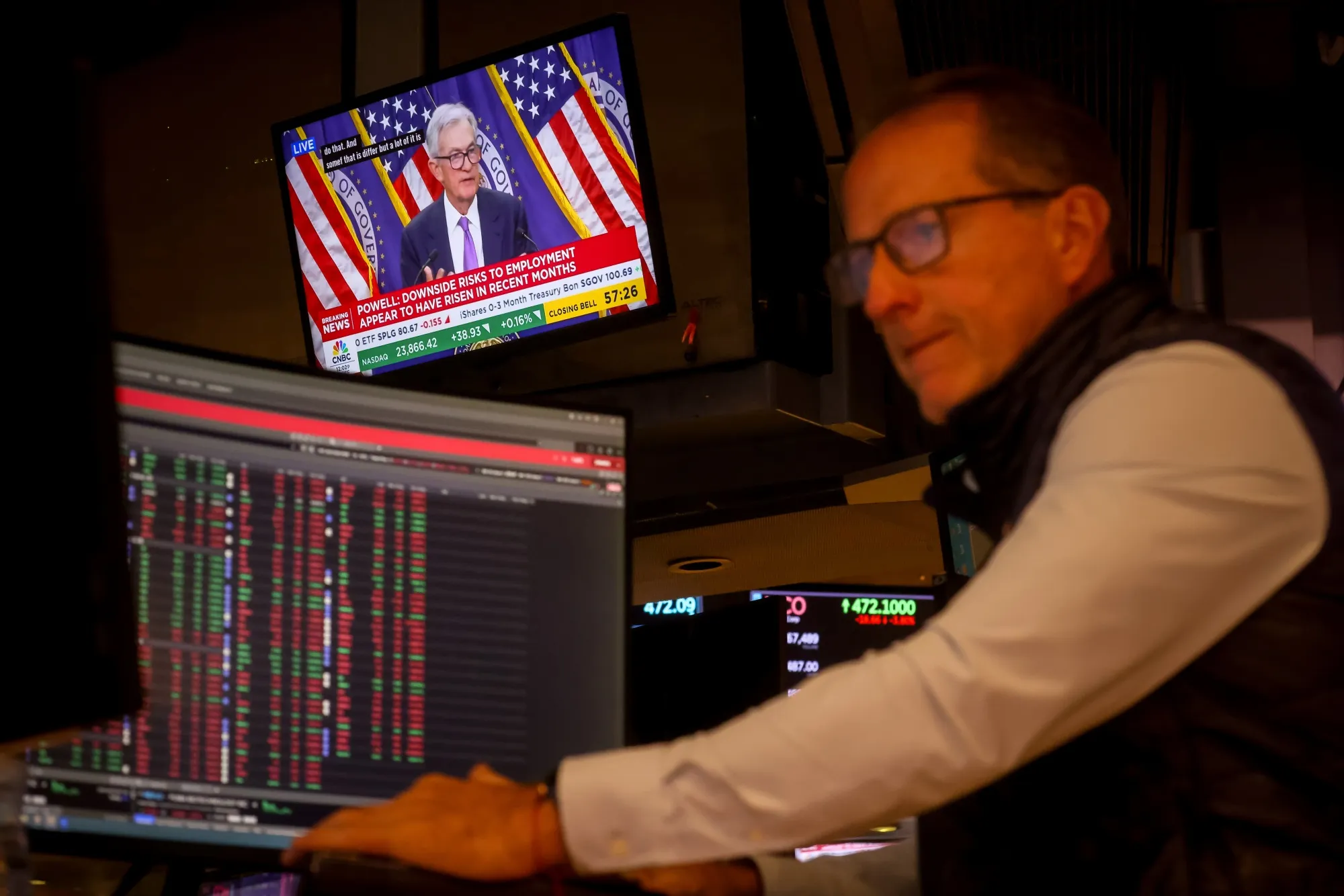 A television station broadcasts Jerome Powell speaking after a Federal Open Market Committee meeting on the floor of the New York Stock Exchange in New York on Oct. 29.