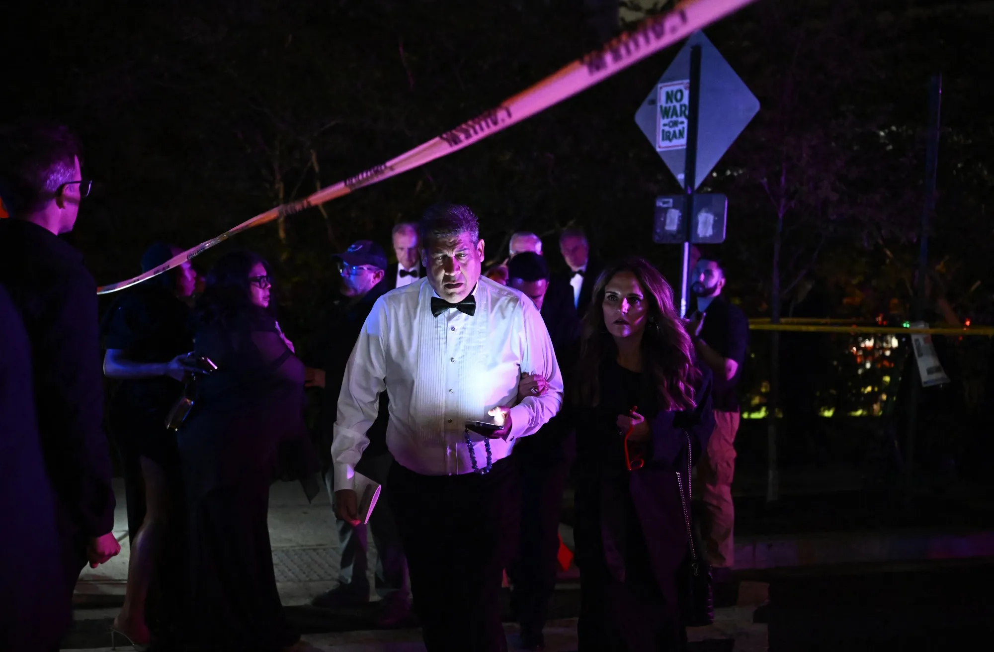 Attendees leave the Washington Hilton after shots were heard during the White House Correspondents’ Dinner on April 25.