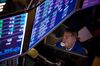 A trader blows a bubble with gum on the floor of the New York Stock Exchange (NYSE) in New York, U.S., on Friday, Aug. 18, 2017. Stocks were mixed and the S&P 500 Index turned higher as investors digested the political upheaval in the U.S. and the latest terrorist attack in Europe.