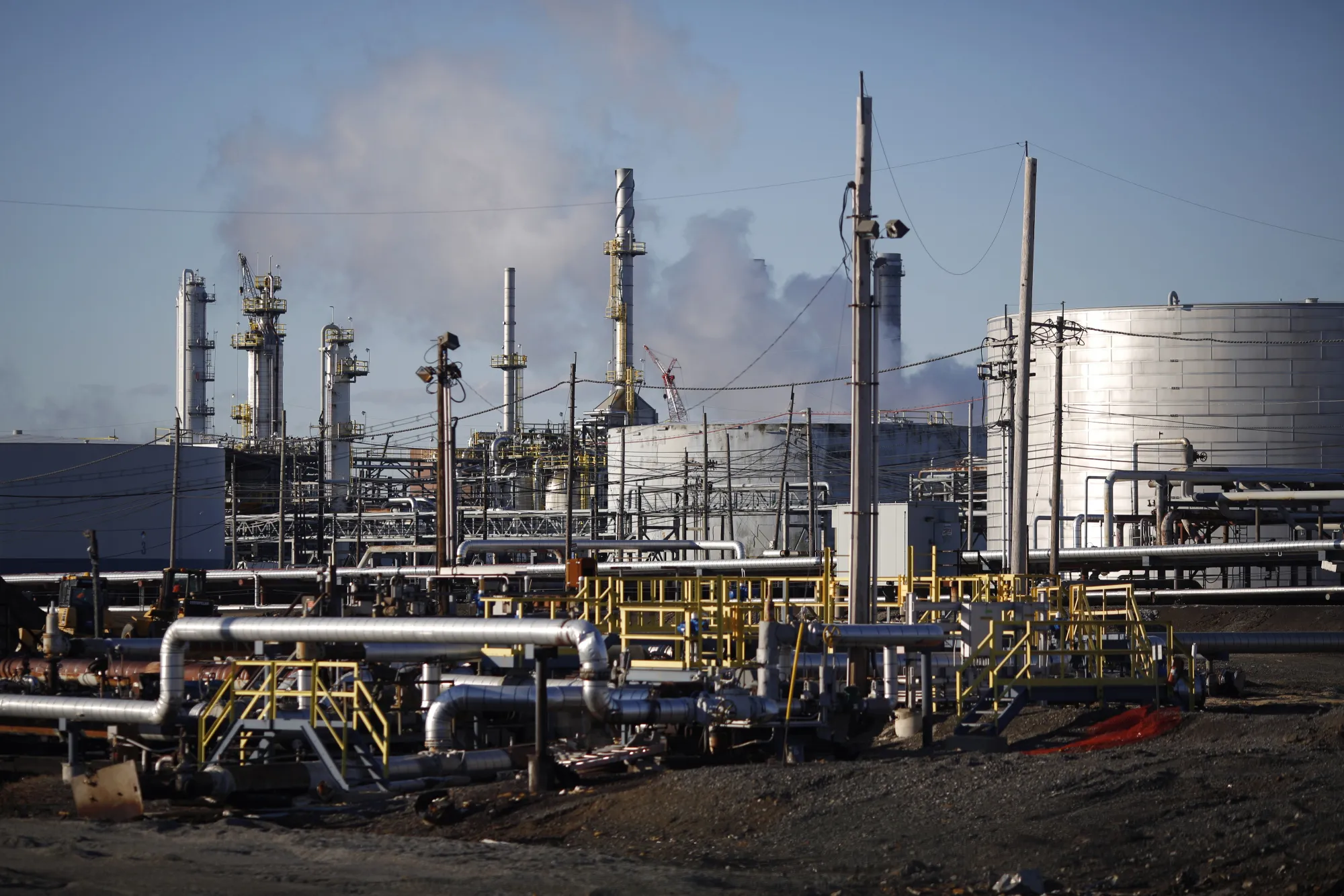 Ethane terminal pipelines and other infrastructure stands inside the Sunoco Logistics Marcus Hook Industrial Complex in Marcus Hook, Pennsylvania, U.S., on Friday, April 8, 2016. U.S. production of ethane, a key feedstock for petrochemical manufacturing, is expected to increase to 1.4 million barrels per day by 2017 as more facilities come online, according to Commodity Online.
