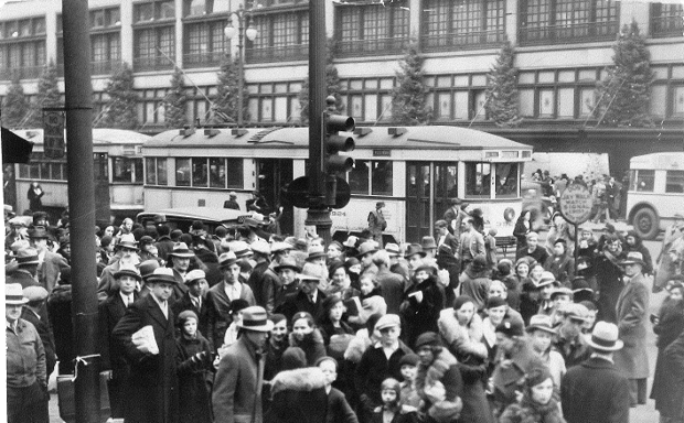 Shoppers and streetcars outside Detroit's Hudson's store.