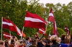 Latvia's national flags are waved&nbsp;in Riga, Latvia.