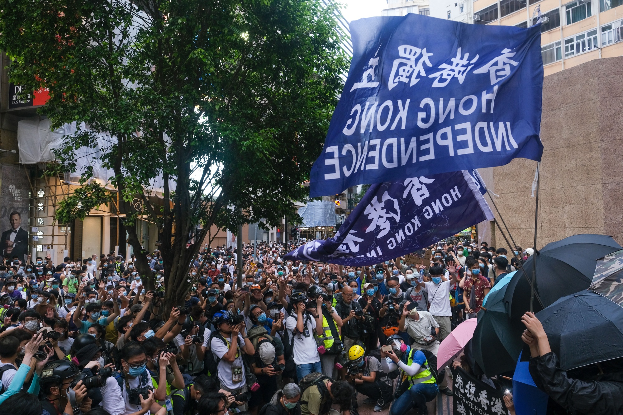 Protesters hold flags that read 'Hong Kong Independence' during a protest on July 1.