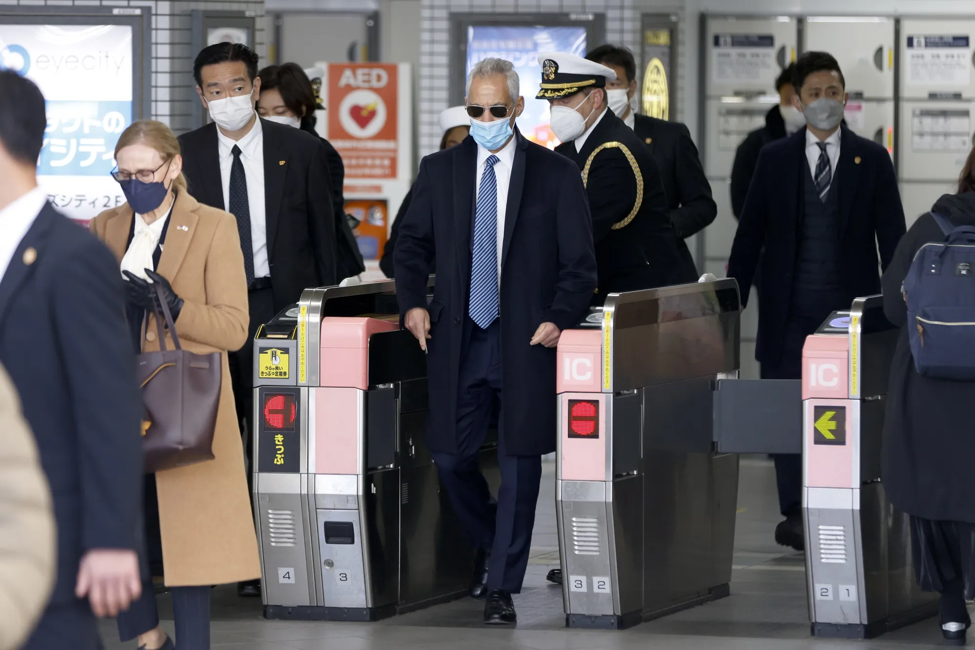 Rahm Emanuel walks through an automatic ticket gate at Yokosuka Chuo station in Yokosuka, Kanagawa prefecture, Japan, on&nbsp;Feb. 17, 2022.