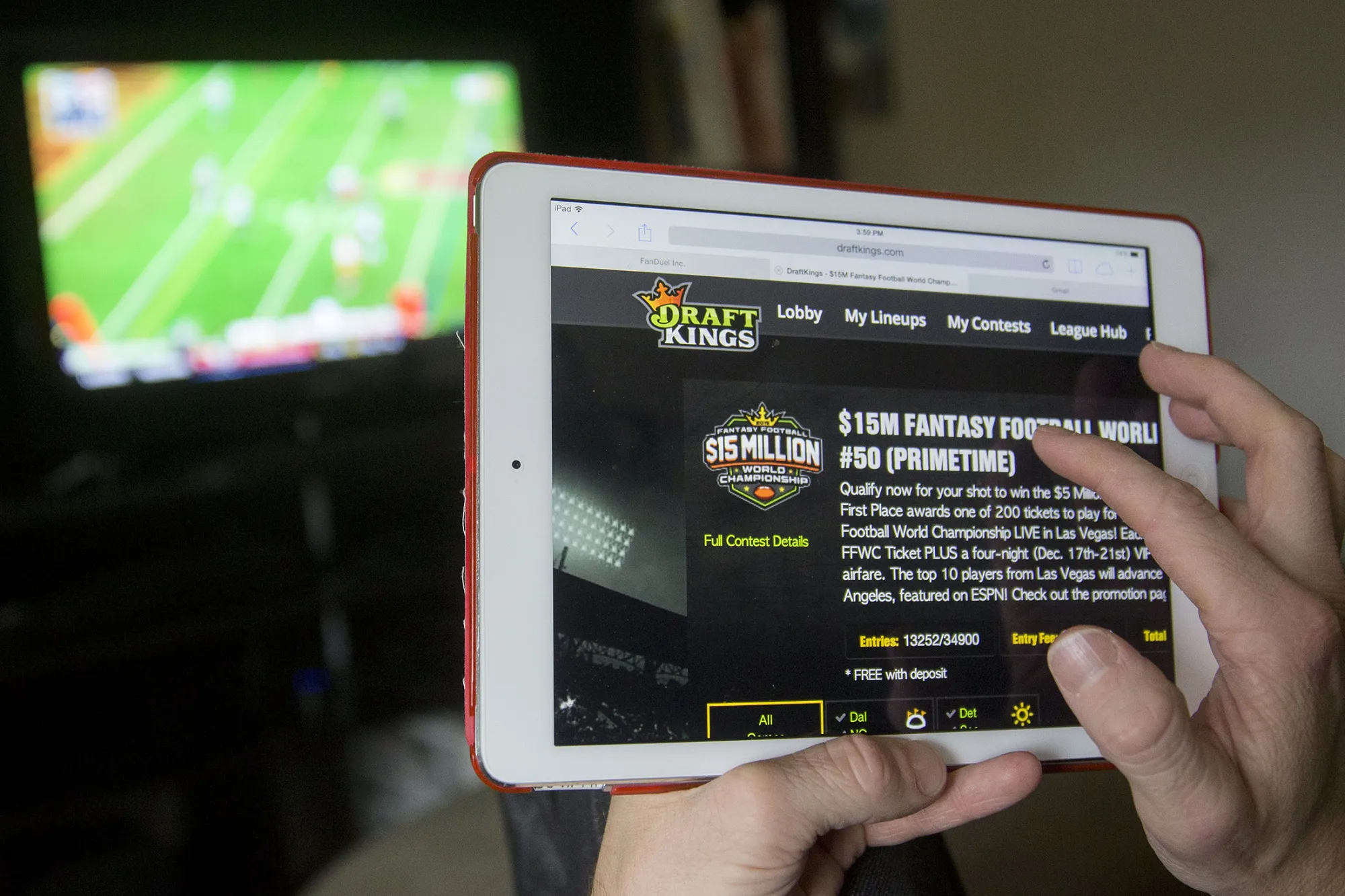 The DraftKings Inc. website is arranged for a photograph on an Apple Inc. iPad in Washington, D.C., U.S., on Sunday, Oct. 4, 2015. Fantasy sports companies DraftKings Inc. and FanDuel Inc. raised a total of $575 million in July from investors including KKR &amp; Co., 21st Century Fox Inc. and Major League Baseball to attract players to games that pay out millions of dollars in cash prizes in daily contests.
