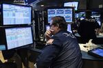 A trader works on the floor of the New York Stock Exchange.