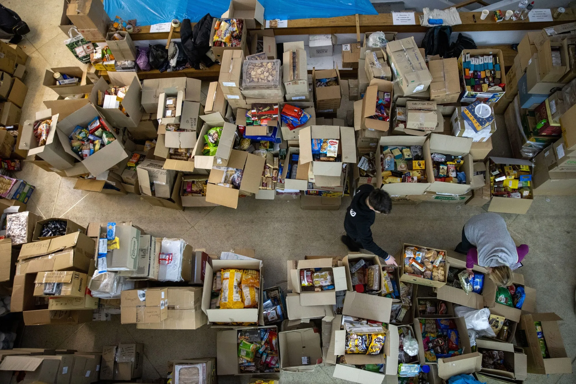 Volunteers sort donated provisions in Lviv, Ukraine in the kind of relief efforts being supported by the crypto community.