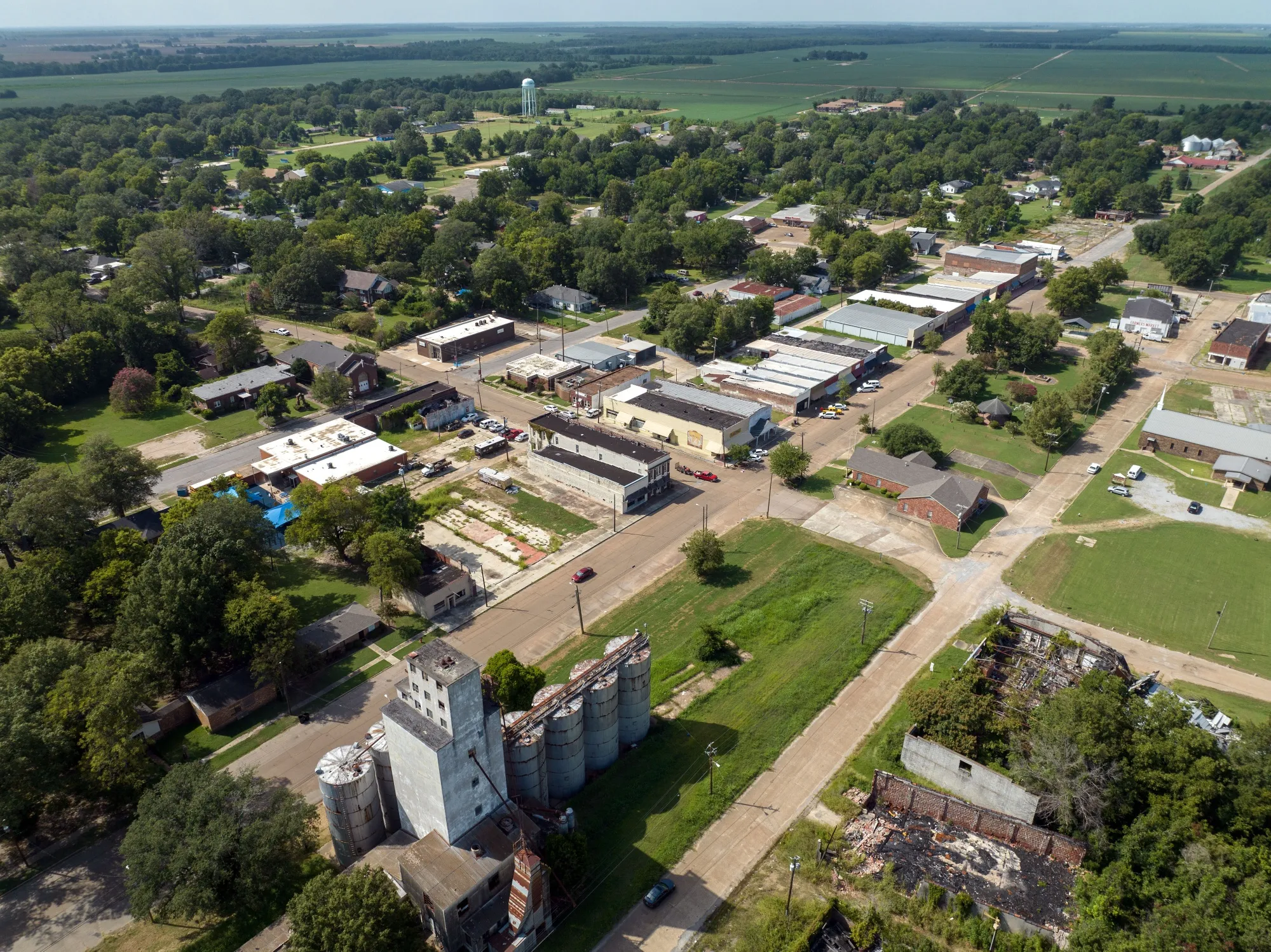 Dilapidated homes and shuttered buildings surround the streets of Drew, Mississippi. 