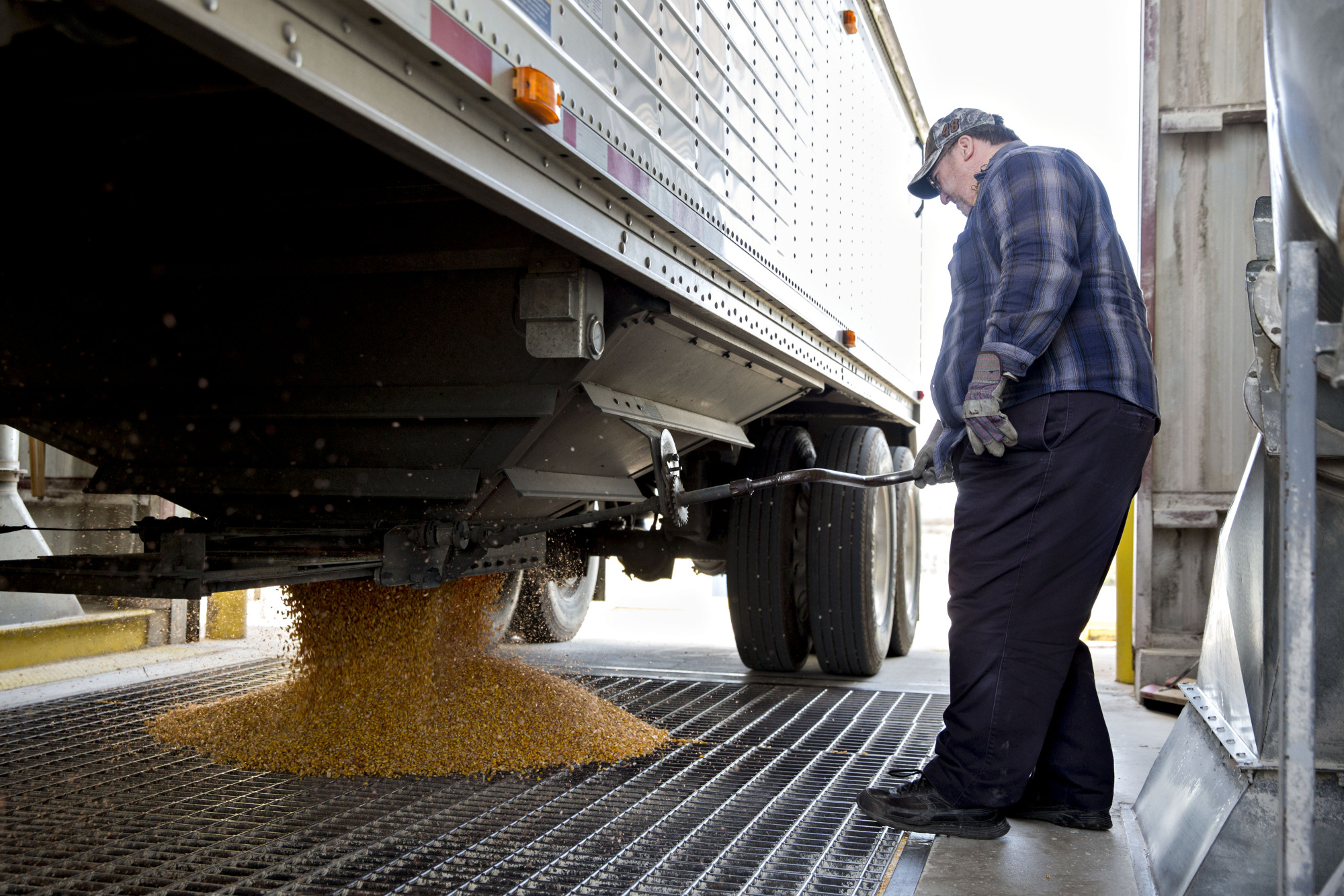 A truck driver unloads corn at the Archer-Daniels-Midland Co. grain facility in Mendota, Illinois.