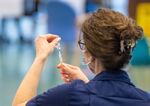 A healthcare worker prepares a dose of the AstraZeneca&nbsp;Covid-19 vaccine in Epsom, UK.