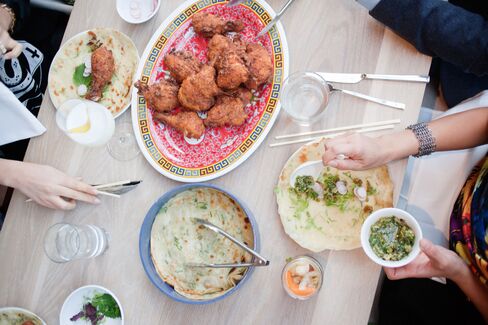 Momofuku Toronto's fried chicken with vegetables, scallion pancakes, and Tabasco salt.