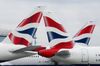 Tail fins sit on passenger aircraft, operated by British Airways.