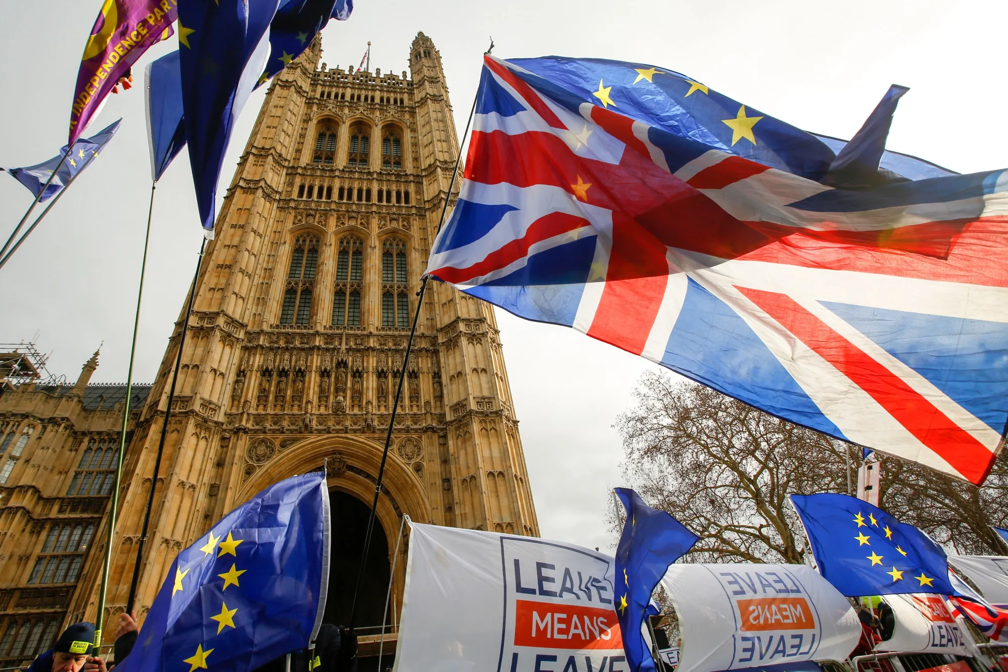 Anti and pro-Brexit demonstrators wave European Union (EU), British Union flags, also known as Union Jacks, and banners during protests outside the Houses of Parliament in London on Jan. 15.