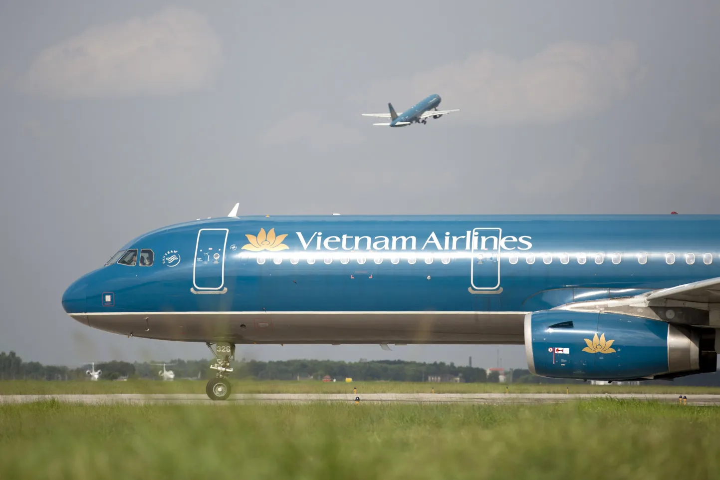 A Vietnam Airlines aircraft taxis on a runway at Noi Bai International Airport in Hanoi, Vietnam.