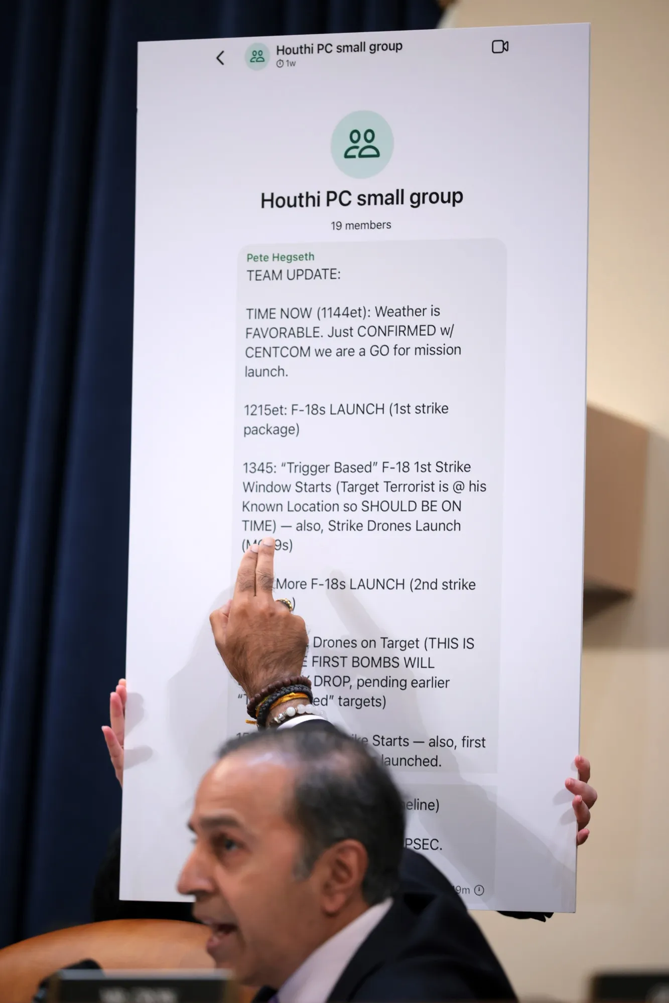 Leaked Signal messages between members of the Trump administration are displayed during a House intelligence hearing on March 26, 2025.