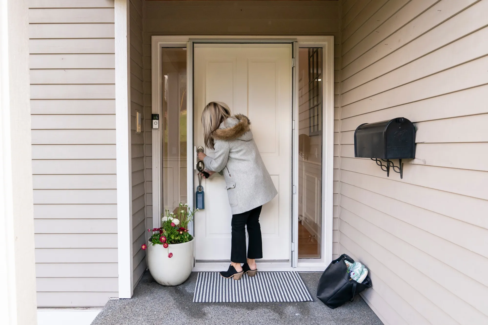 A realtor locks the door following an open house at a home in Seattle, Washington.