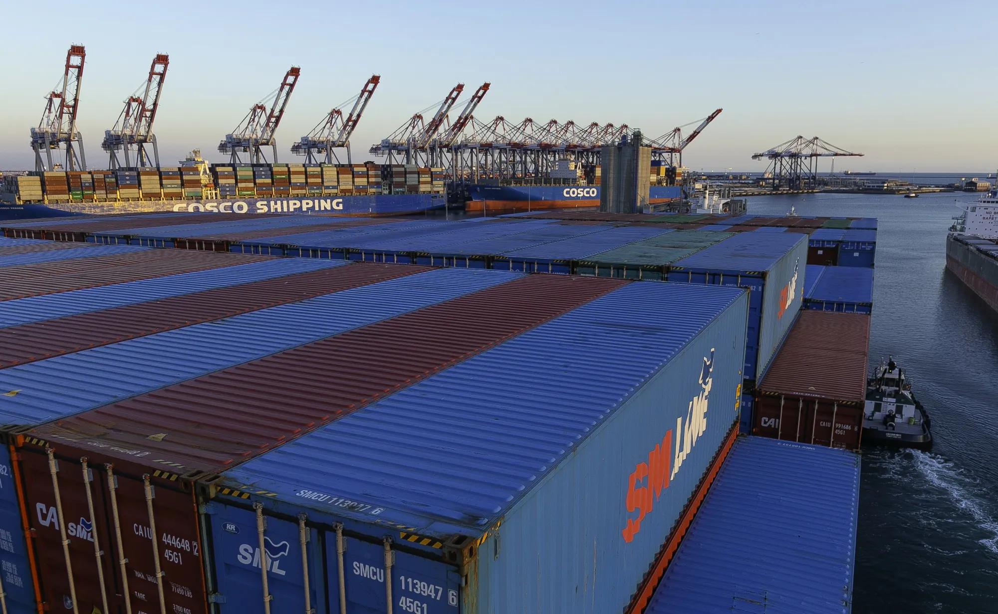 A container ship departs the Port of Long Beach in Long Beach, California.