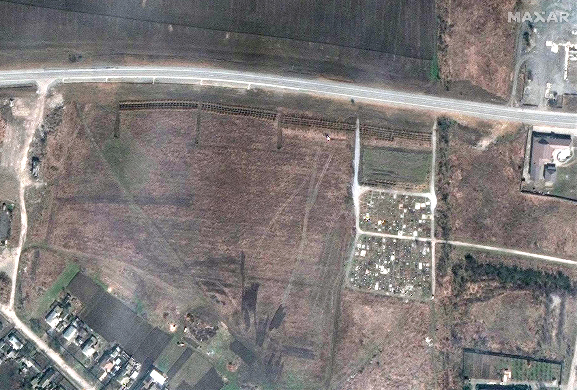A satellite image showing an overview of the cemetery in Manhush, west of Mariupol, Ukraine.