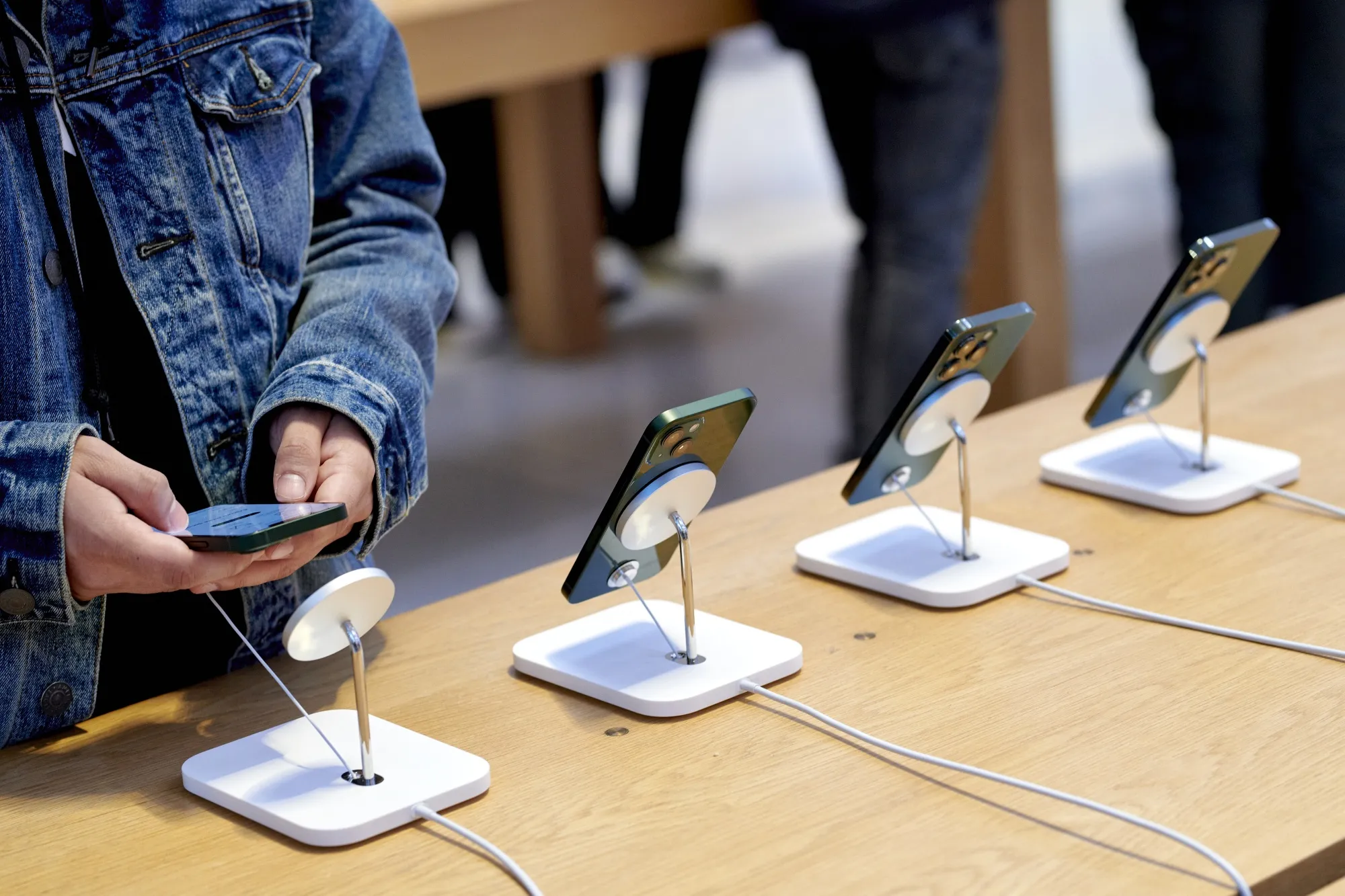 A customer views an Apple iPhone 13 Pro and Pro Max at the company’s flagship store in New York.
