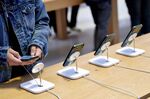 A customer views an Apple iPhone 13 Pro and Pro Max at the company’s flagship store in New York.