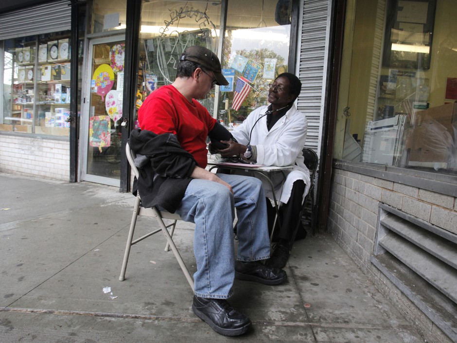 Unemployed Bobby Byrd, who has been medically trained by the Red Cross, uses his training for donations on Manhattan sidewalks.