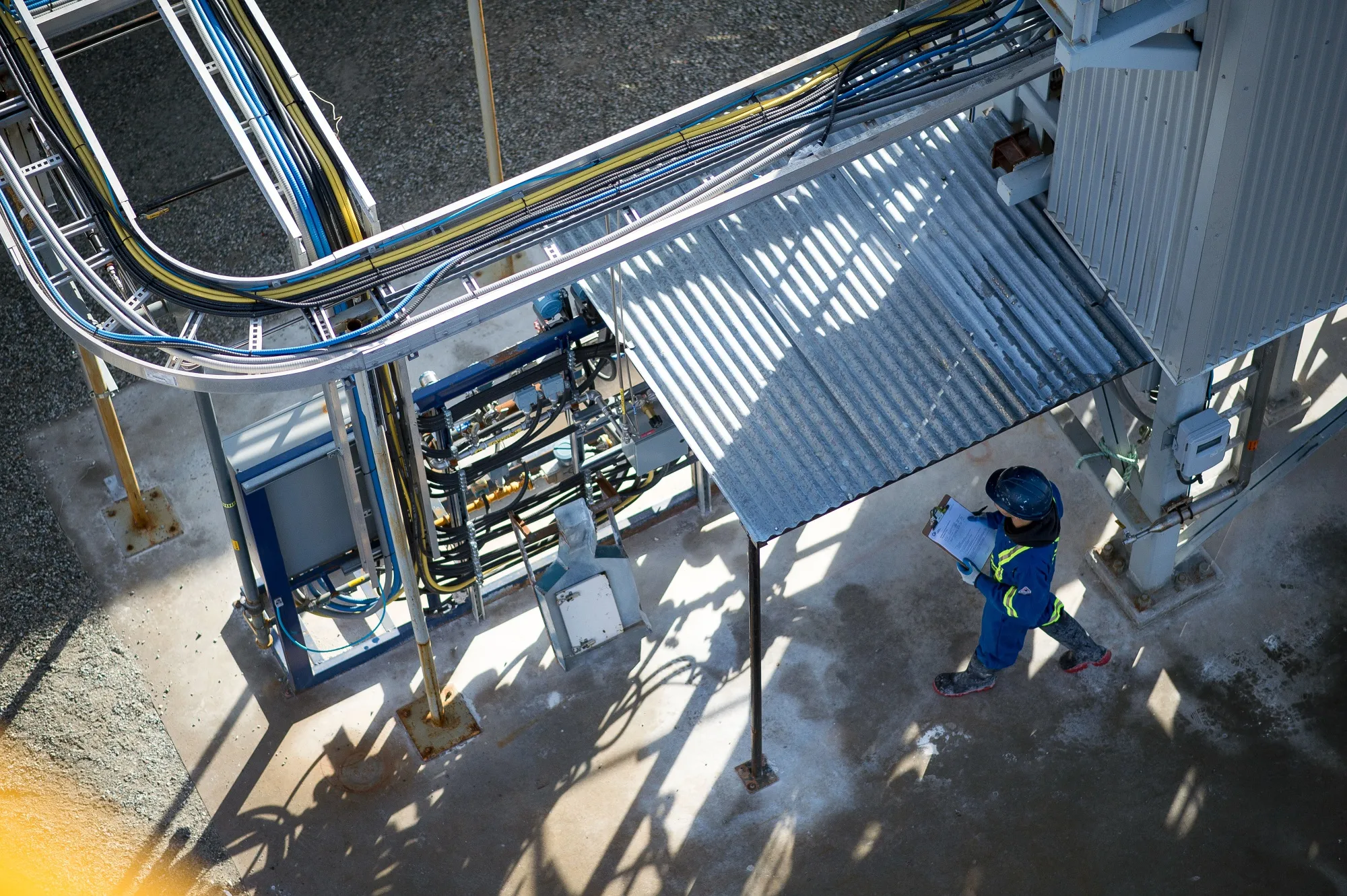 A technician&nbsp;inspects systems at a direct air carbon capture facility.