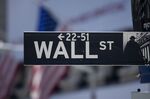 A Wall Street sign hangs in New York, U.S.
