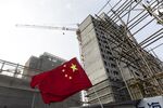 A Chinese flag flies outside Kaisa Group Holdings Ltd.'s Future City development site in Shanghai.