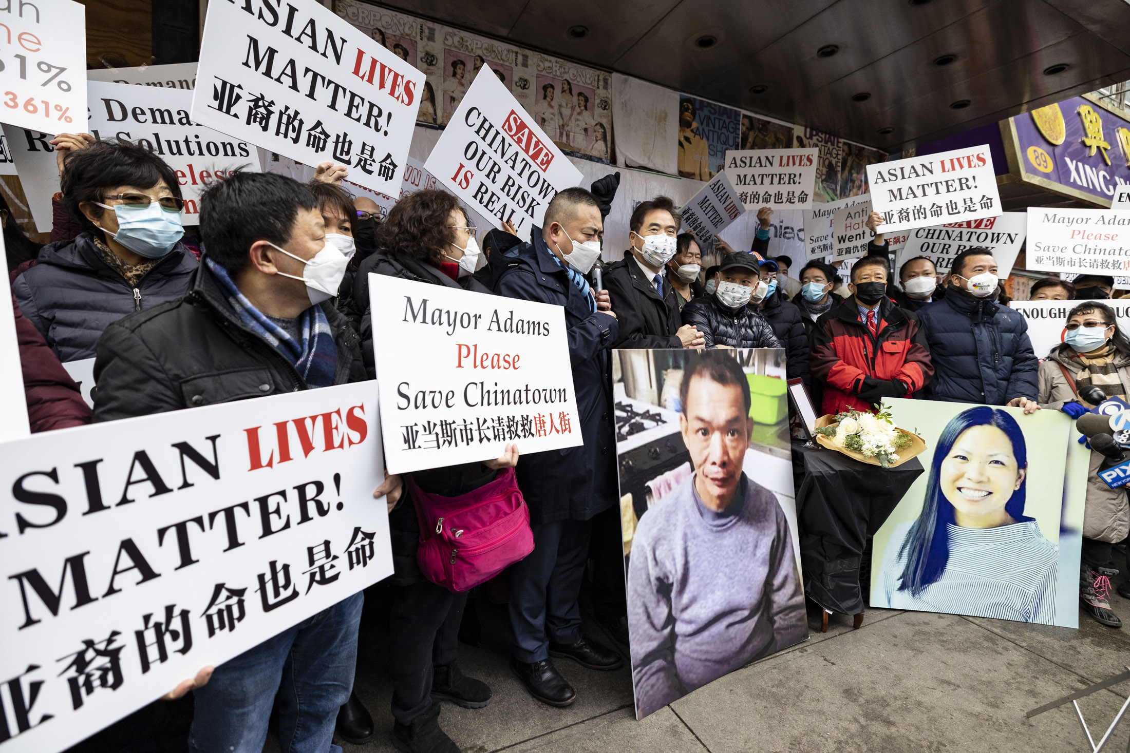 Demonstrators in Manhattan’s Chinatown protest surging violence against Asian-Americans, including victims Yao Pan Ma, pictured in poster on left, and Michelle Go, poster on right.