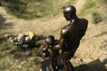 &nbsp;A bronze sculpture depicting Kobe Bryant, daughter Gianna Bryant, and the names of those who died, is displayed as a one-day temporary memorial at the site of a 2020 helicopter crash in Calabasas, California.