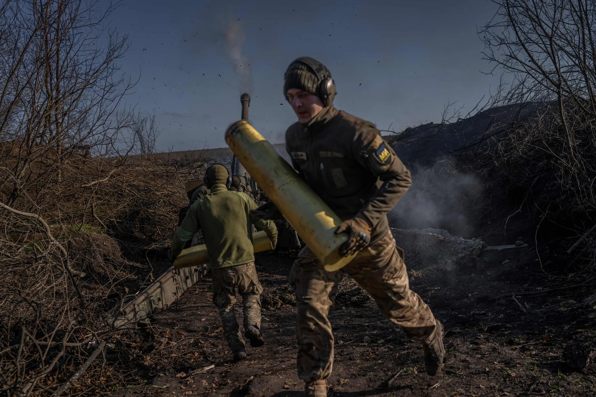 Ukrainian soldiers fire towards Russian positions in Donetsk Oblast, Ukraine.