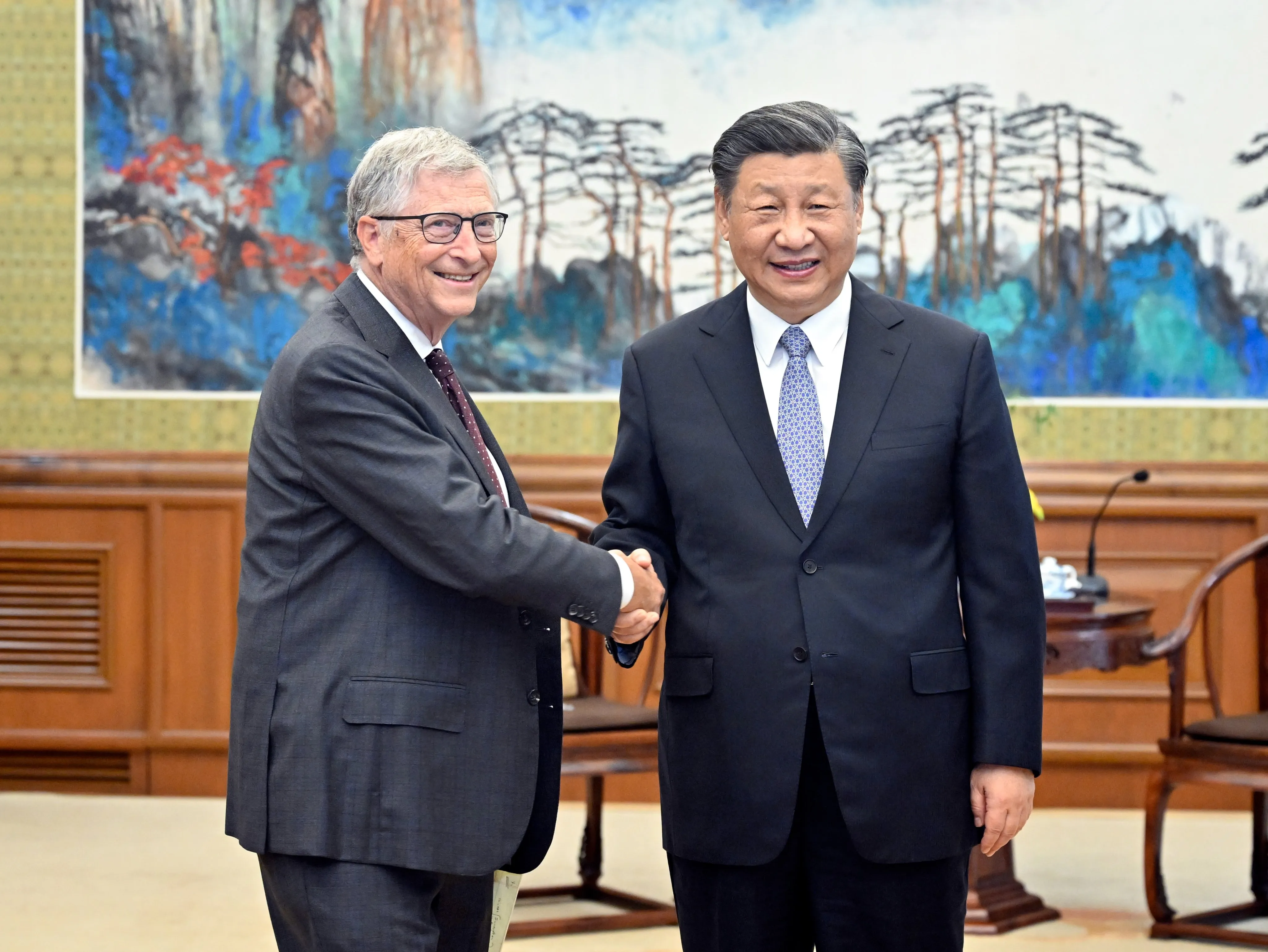 Bill Gates shakes hands with Xi Jinping in Beijing on June 16.