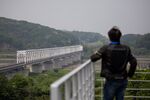A visitor looks across to the north side of the border at the Imjingak pavilion near the Demilitarized Zone (DMZ) in Paju, South Korea, on Wednesday, June 17, 2020.