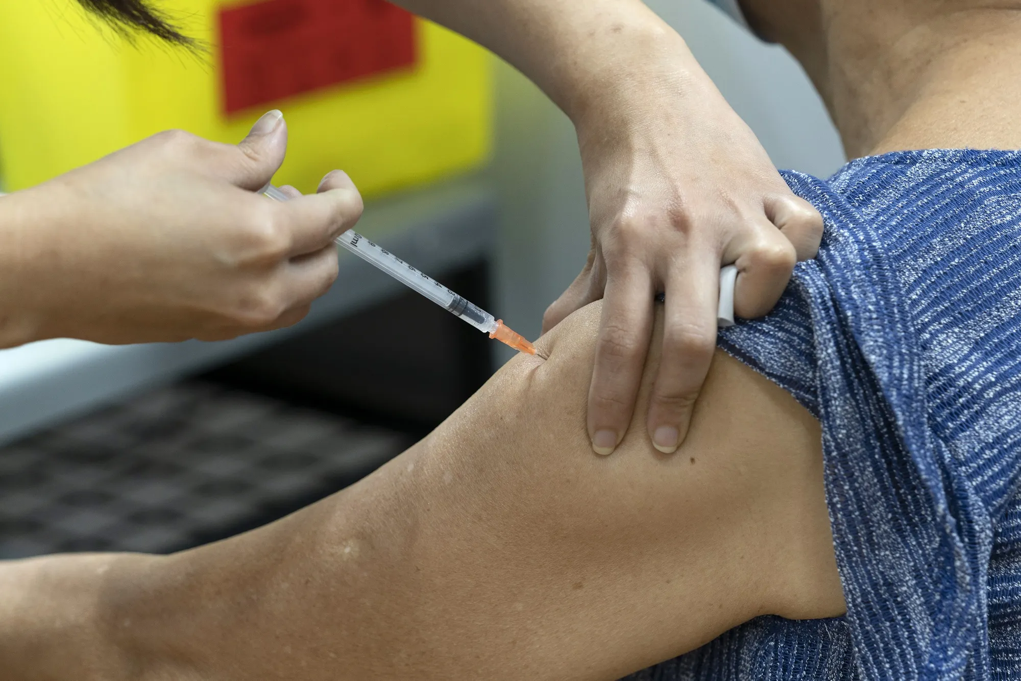 Inoculating Seniors at a Vaccination Center as Singapore is Prioritizing Safely Reopening Its Borders