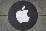 An Apple Inc. logo on the pavement outside a store in San Francisco, California.