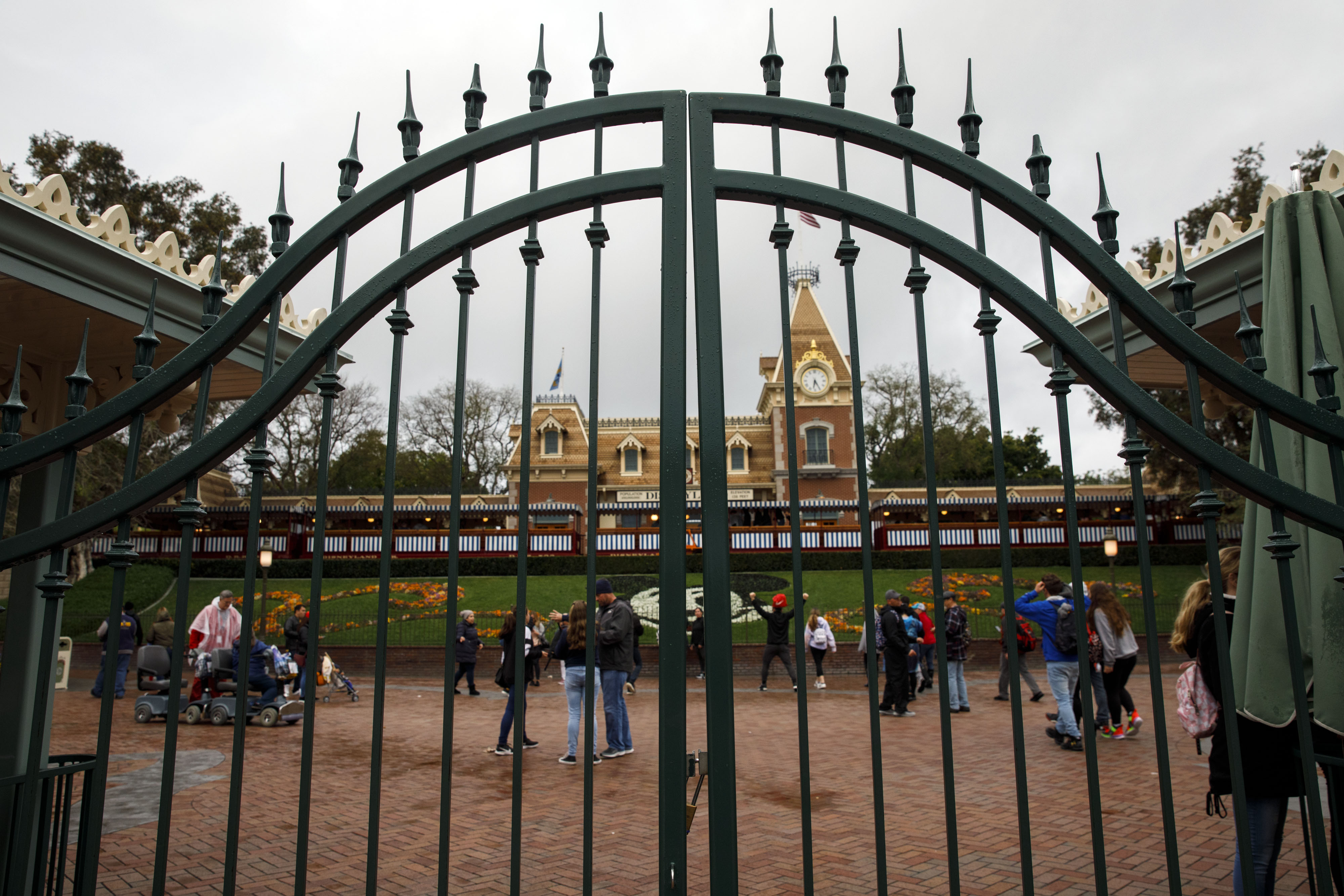 Disney Fans Descend On Theme Parks Before Virus Shuts Them Down