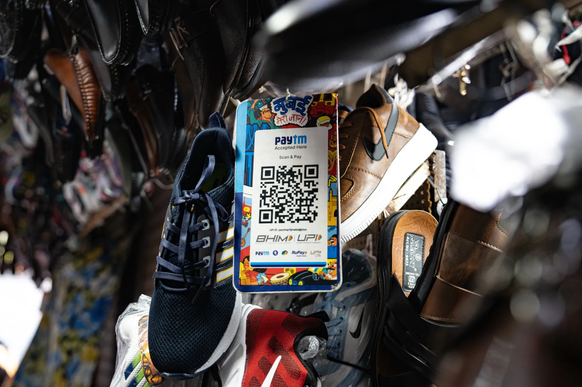 A QR code for the Paytm digital payment system at a shoe store in Mumbai, India.